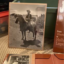 John Wayne Collectible Book And 6 , 8x10 Prints. Never Opened. 