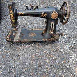 Antique sewing machine and 22 vintage sewing patterns from mostly from the 60's, 70's and 80's 