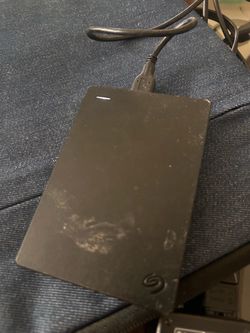 black Seagate Portable Drive external hard drive connected via a USB cable