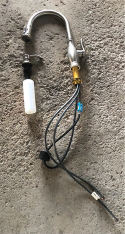 Delta faucet with soap dispenser bottle