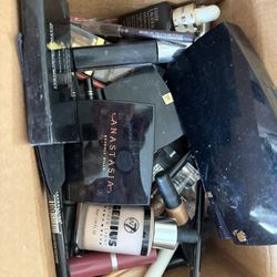 Large box full of used cosmetics and perfumes