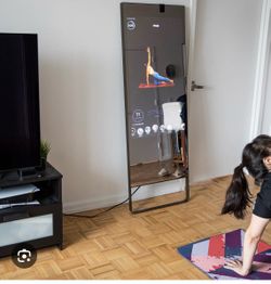 Lulu Lemon Studio Mirror (Peloton) with heart rate monitor and fitness bands