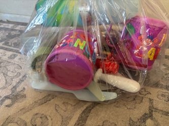Kids cups, bottle of water and utensils.