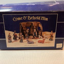 This item is a Vintage Christmas 12 Piece Porcelain Nativity Set featuring a stable box