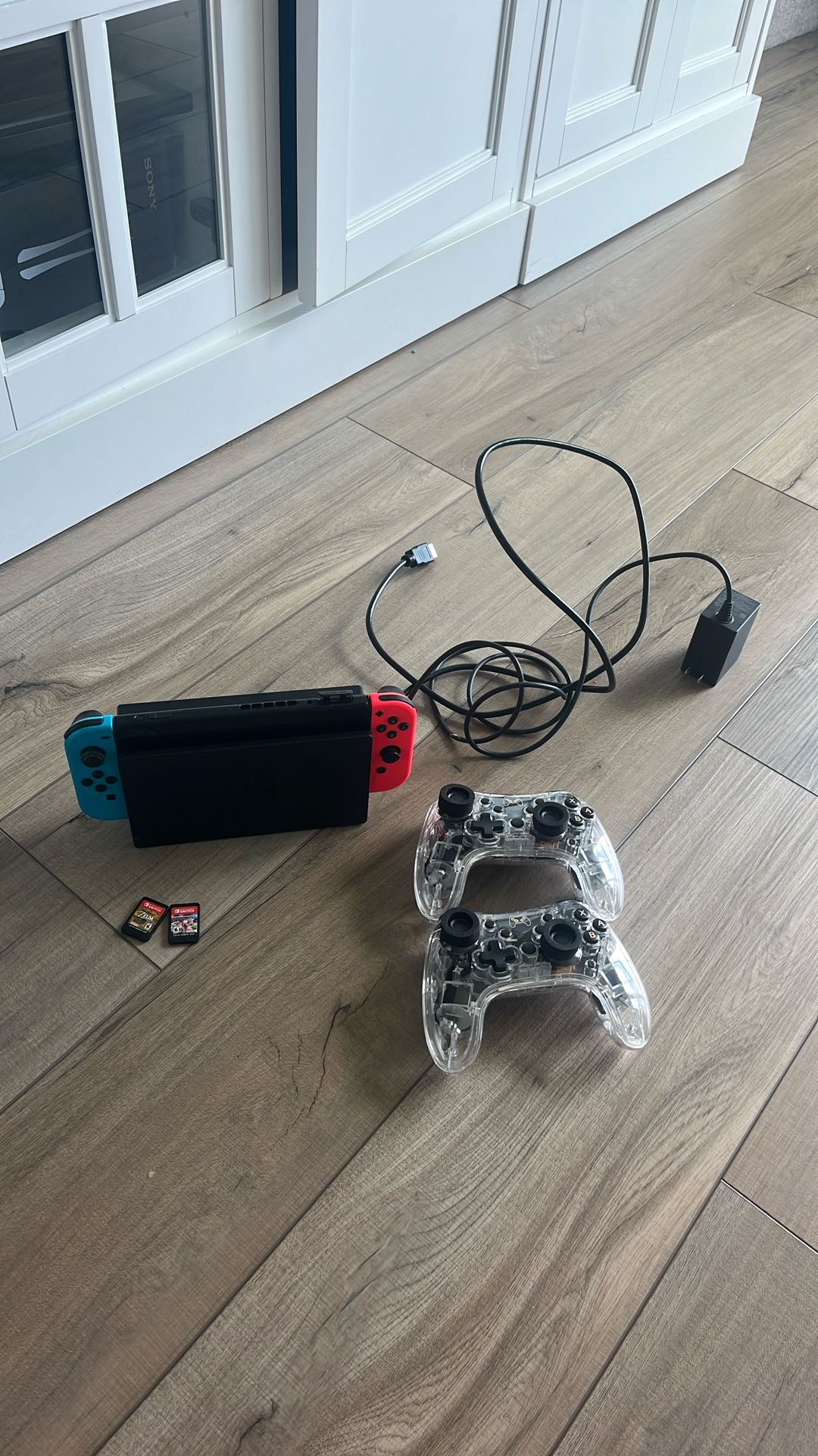 nintendo switch with games and wireless controllers