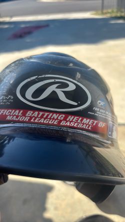 2 baseball helmets and 2 baseball bats bats
