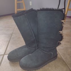 UGG Tall Bailey Bow II Boots in Black size 10
Classic black suede UGG boots with triple ribbon bows along the back