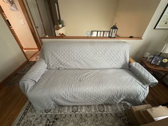 Futon with Gray Quilted Cover
