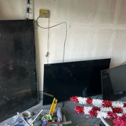 4 broken tvs