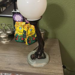 Very unique lamp I don’t know if that’s made out of Jade on the bottom base