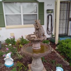 Bear Eating Out Of The Tree Fountain 