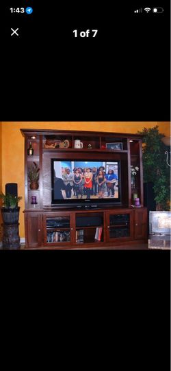 Large Wood Entertainment Center. Fits TVs up to 65”