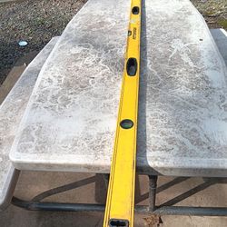 Six foot level, tool belt. pliers 
