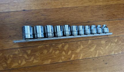 Genuine Snap-on USA 11-piece SAE shallow 6-point socket set with metal storage rail.