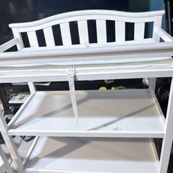 Delta Children Flat Top Changing Table with Wheels and Changing Pad