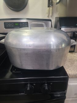 Large Wagner Cast-aluminum typically used for roasting large turkeys, hams, or heavy family meals.