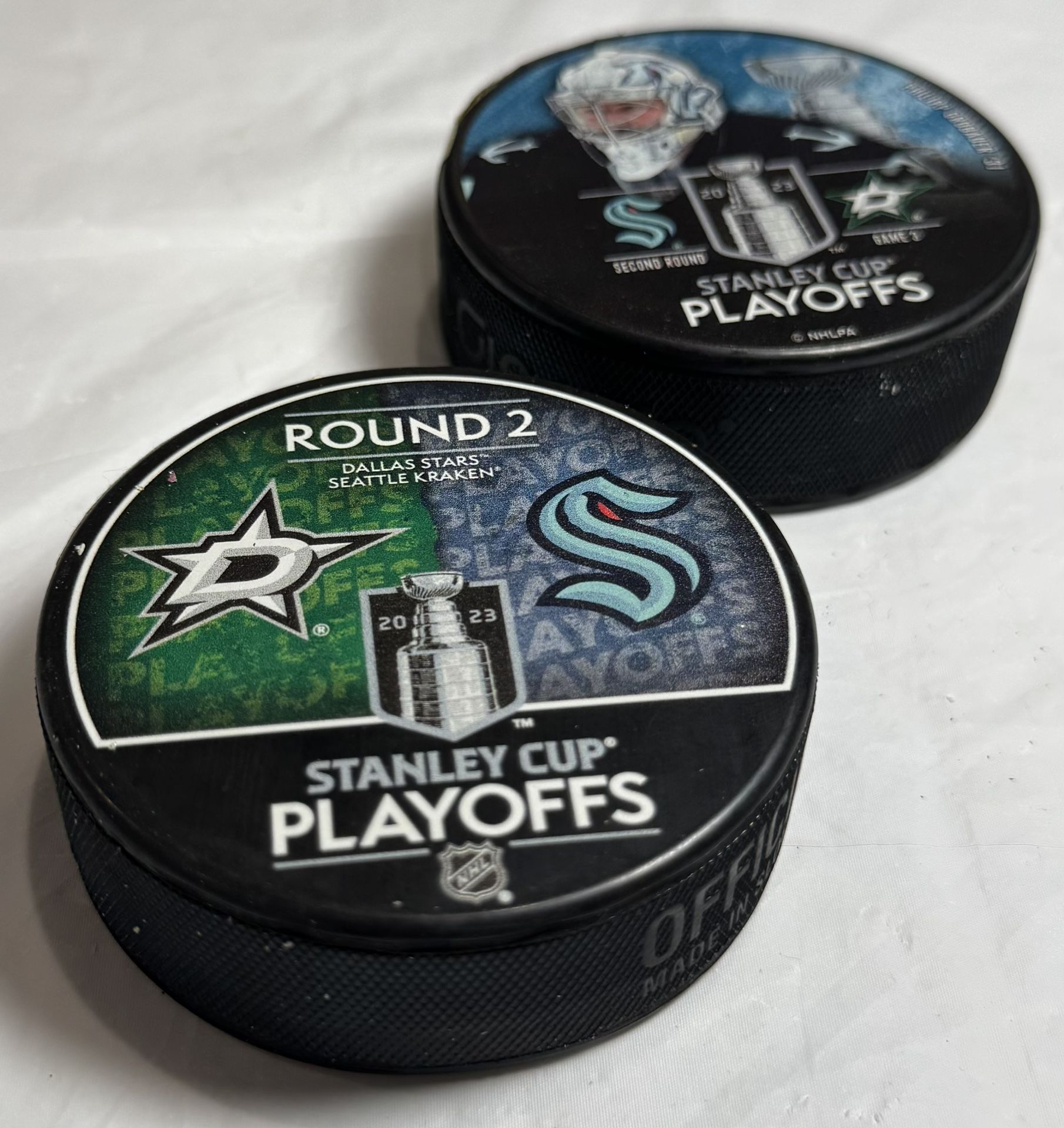 Stanley Cup Playoffs NHL 2023 – Seattle Kraken vs Dallas Stars – Official Game Pucks (Set of 2)