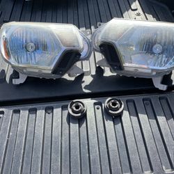 2013 Toyota Tacoma OEM headlights + bulbs 