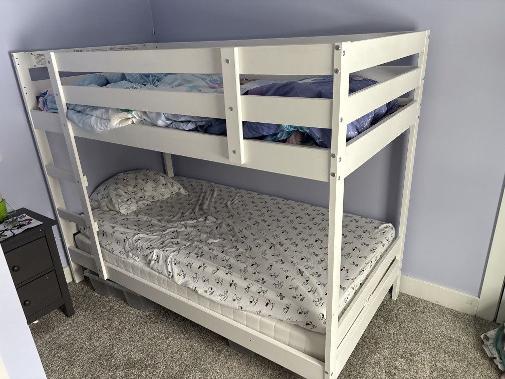 IKEA twin size bunkbed 2 4 inch mattresses included if wanted. Total height is 5 ft.