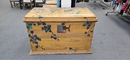 Antique hand-painted wooden blanket chest/storage box featuring a warm ochre or natural pine finish with hand-painted botanical or floral
