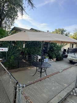 Three Piece Umbrella, One Table 4 Chairs