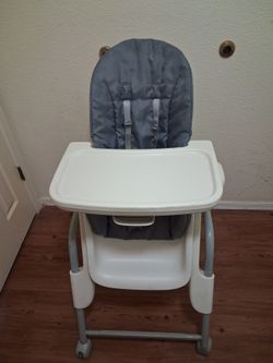 High  chair with wheels  firm sturdy great condition  $23.00 firm price