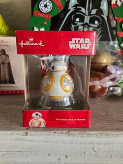 Several Christmas ornaments. Star wars toy story and DC characters