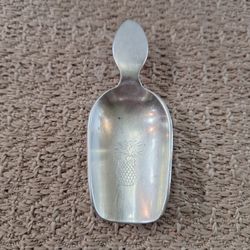 Silver Metal Stieff Sugar Scoop with Pineapple Engraving