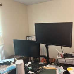 dual monitors with clamping desk mount.