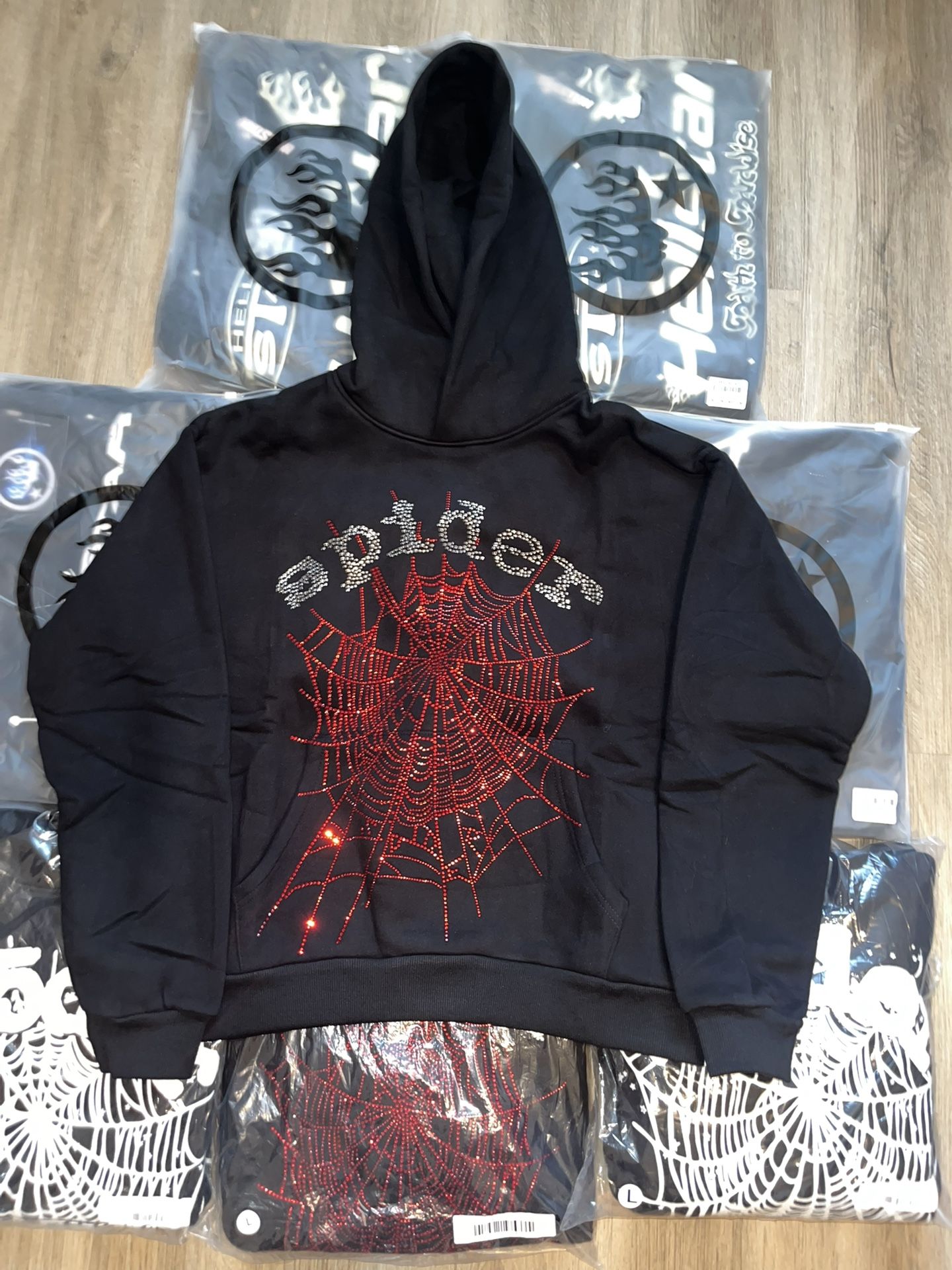 black spider hoodie with red rhine stones size medium
