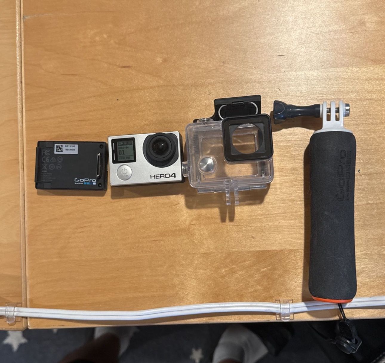 GoPro Hero4 with 128gb SD Card, Handle, Extended Battery, And Waterproofing Case.