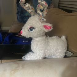 Super Cute reindeer Santa’s reindeer, GLISTEN was sparkly specs on his body, bright blue eyes, silky horns, and silky feet with snowflake so c so cute