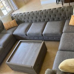 Sofa, Pillows And Table With Two Drawers On Table
