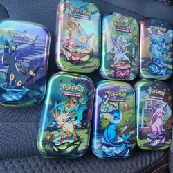 Prismatic Evolution Tins