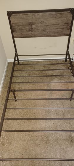 Twinn Beds One With Mattress $200 the One That Doesn't Have A Mattress $125 For The White Bed With The Leather Headboard And Trim $200