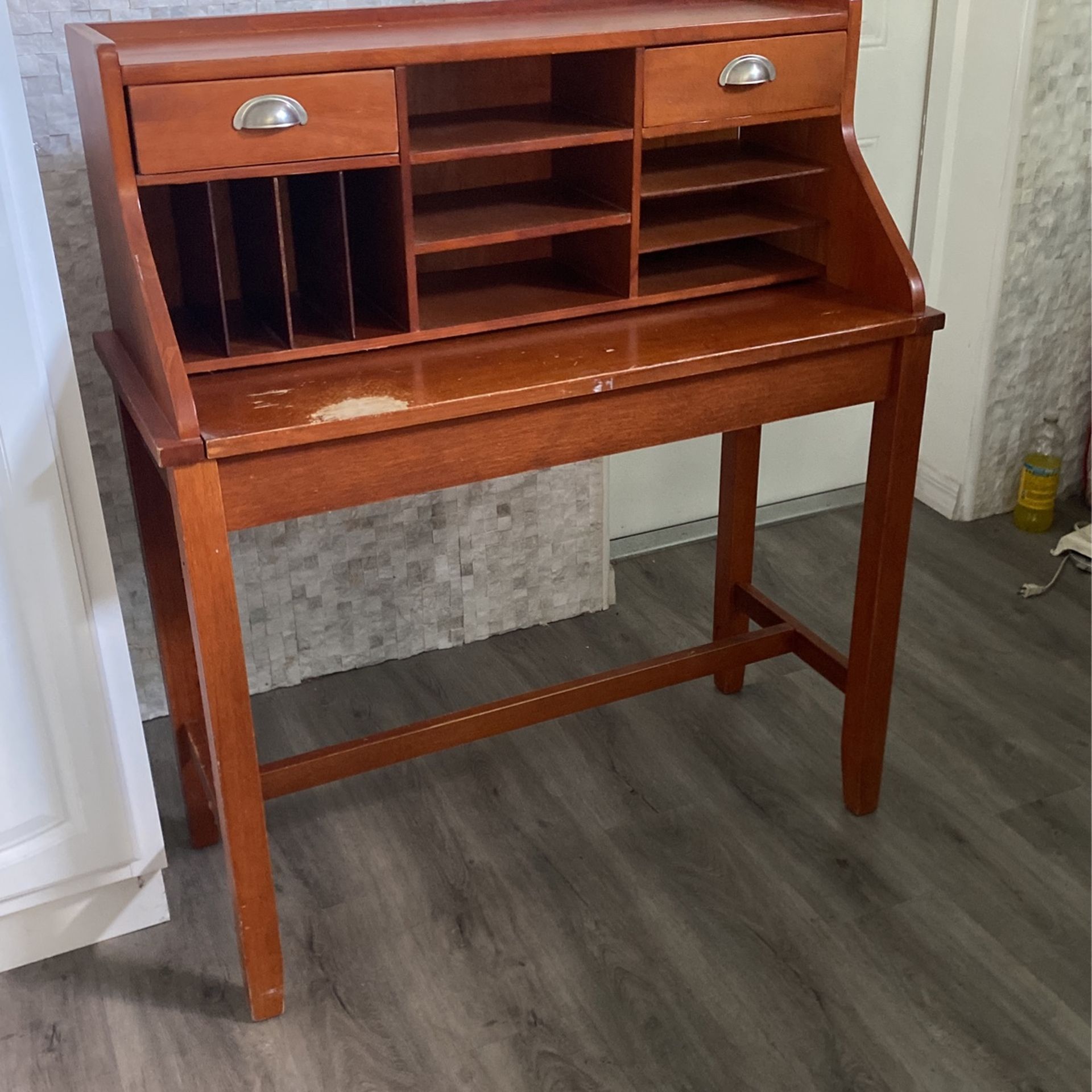 Compact wooden desk with pull out counter, and two drawers