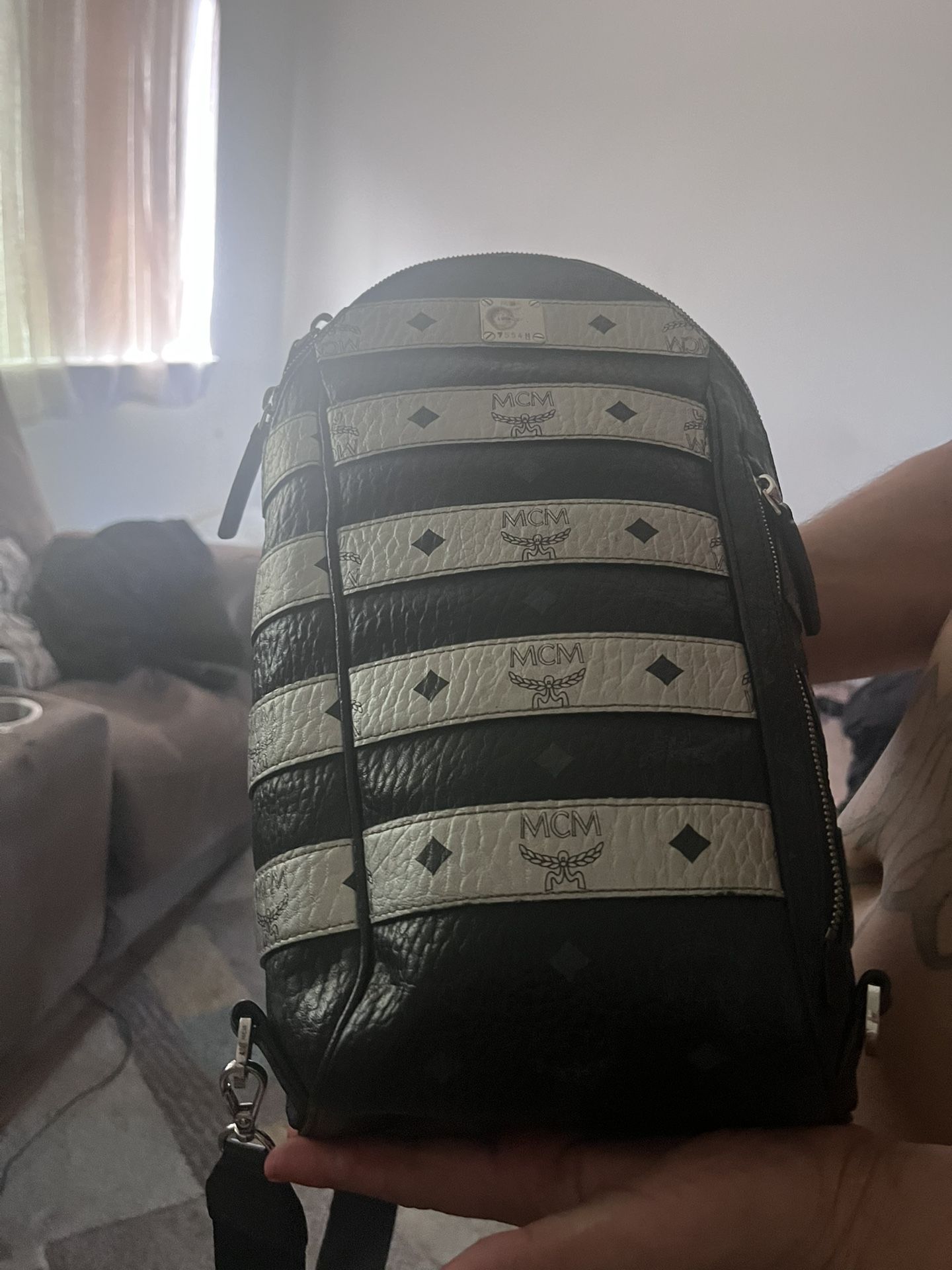 Mcm Sling Backpack