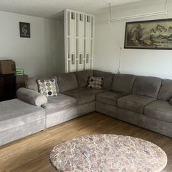 Small Sectional Sofa With Seven Cushions And Three Pillows