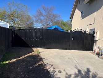 Black Metal Driveway Gate with Scrollwork