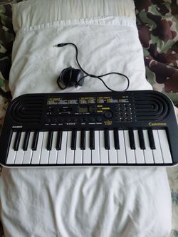 CASIOTONE MINI KEYBOARD..SA-51 WITH PIANO TONES BLACK WITH 32 KEYS