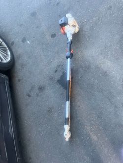 This is a STIHL pole pruner, HT 135 model based on the orange engine housing.