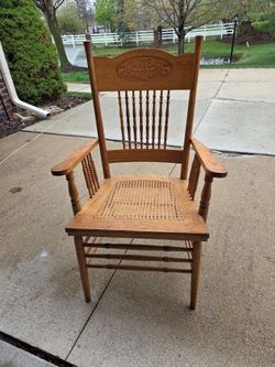 Honey Oak Pressed Back Chair w/ Cane Seat