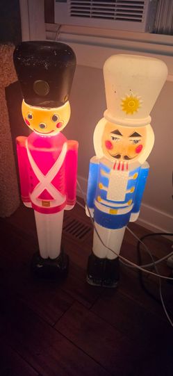 two vintage lighted plastic blow mold Christmas nutcracker and toy soldier decorations
