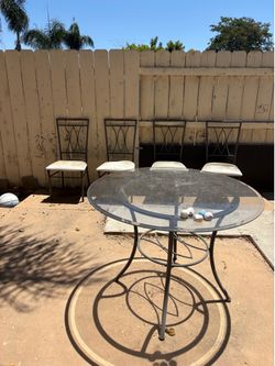 Glass table and 4 chairs