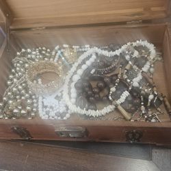 Wooden jewelry box filled