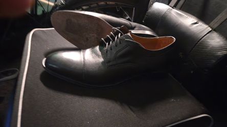 Johnston & Murphy black cap-toe derby dress shoes.