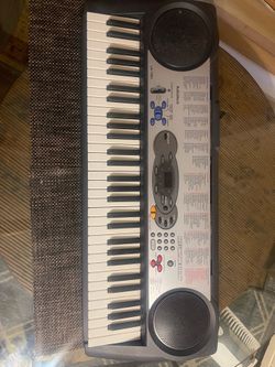 Compact RadioShack electronic keyboard with 61 touch-style keys
