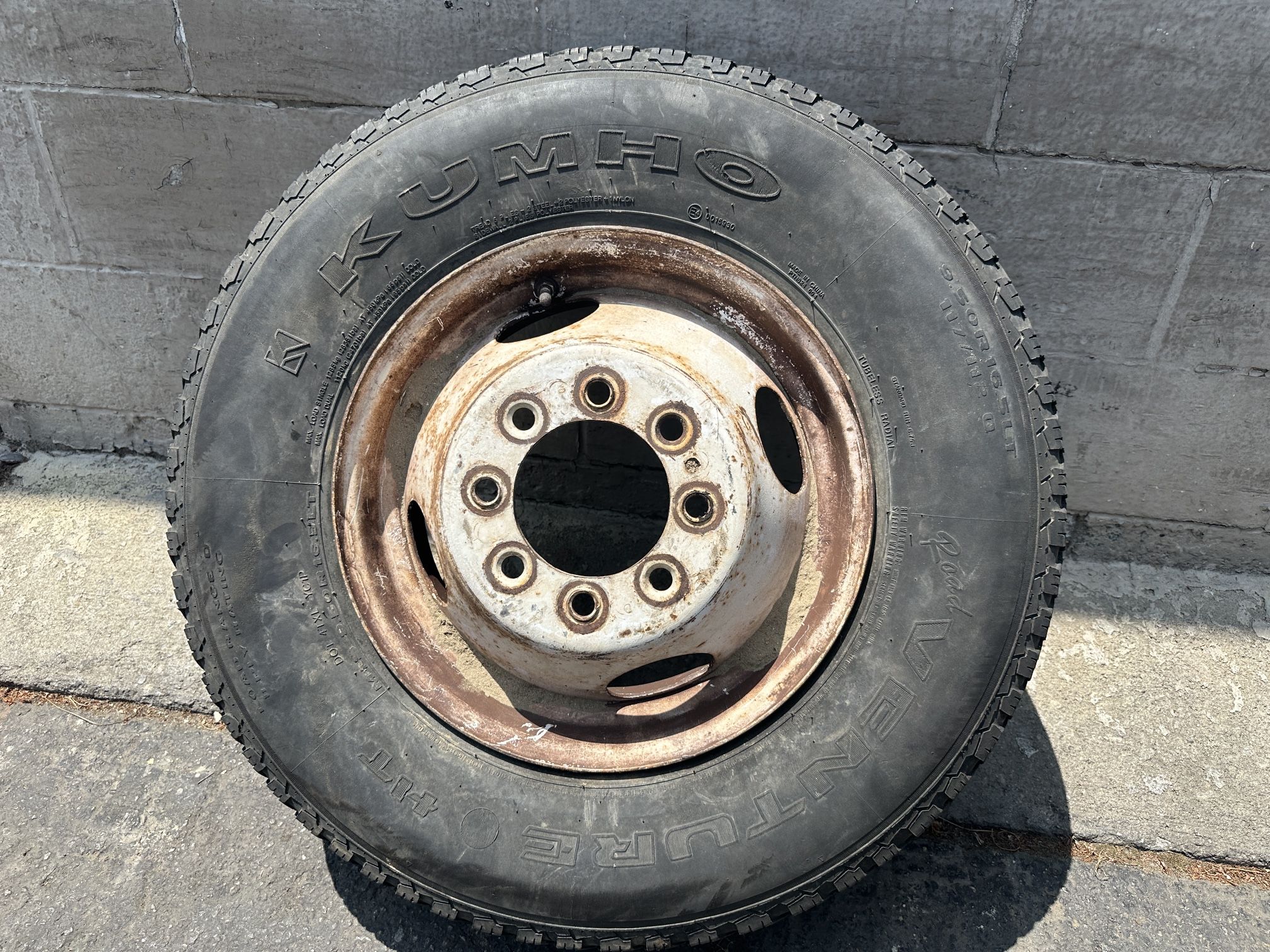 One steel dually rim 16.5 inch, coined lug holes -