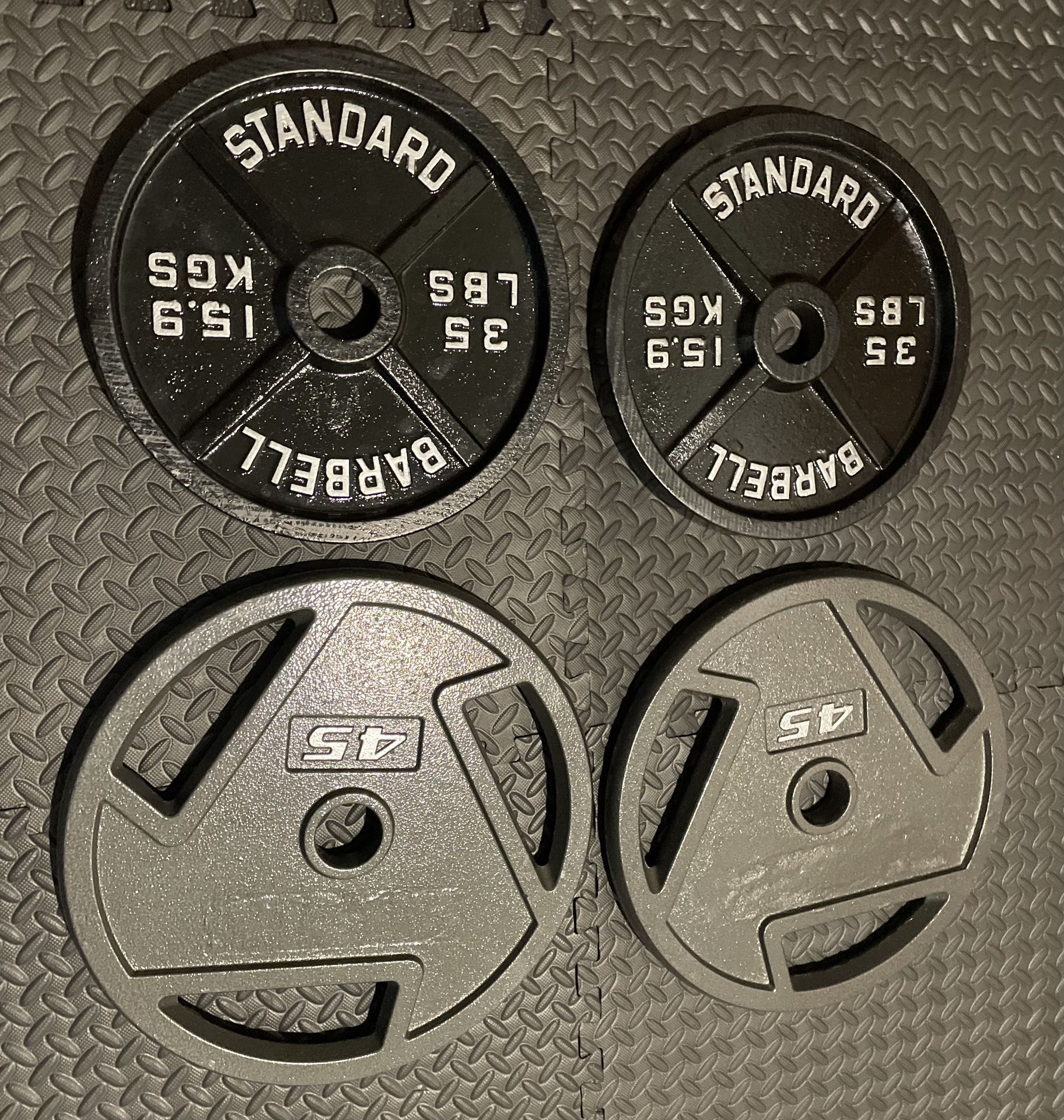 Two Sets Of Cast Iron Weight Plates Brand NEW 45# And 35#