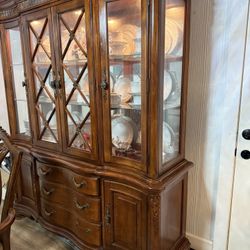 Dining room set, table and 6 chairs, display cabinet with light, all for $450.00.